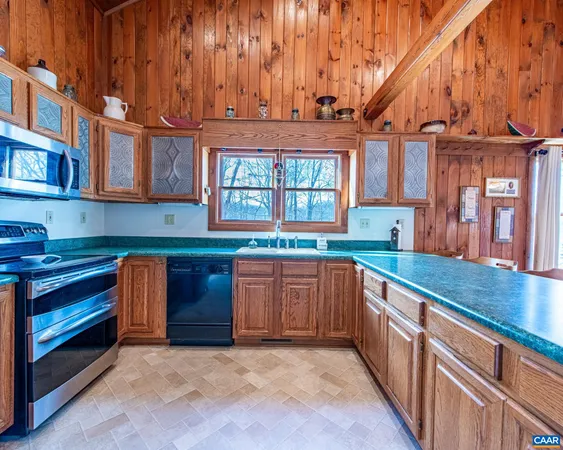 a view of a patio with table and chairs