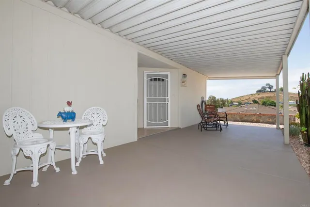 a view of a livingroom with furniture and a window