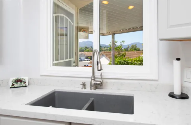 a kitchen with a sink and a window