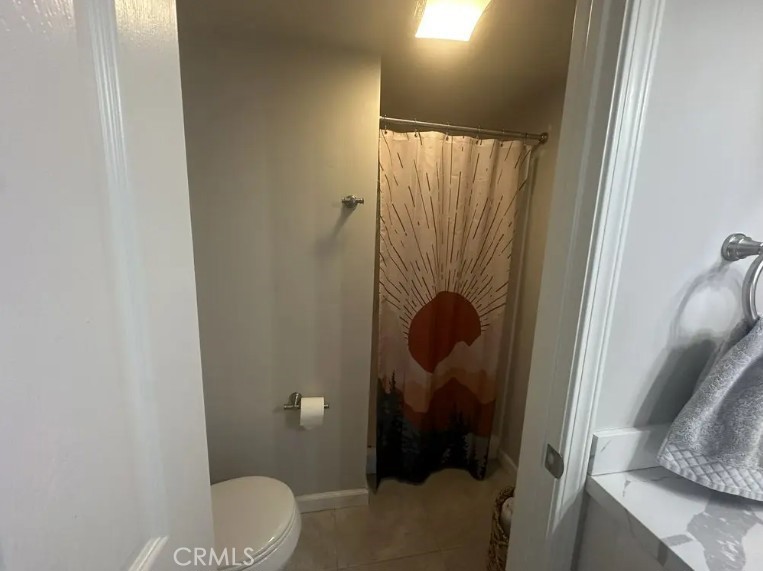 8717 Spring Canyon Drive Spring Valley, CA 91977 - Photo 18 of 34 a bathroom with a shower and toilet