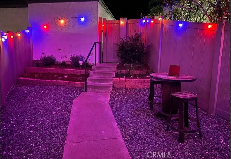8717 Spring Canyon Drive Spring Valley, CA 91977 - Photo 28 of 34 a view of a yard with plants and a bench