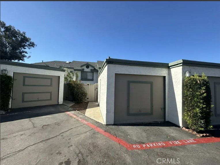 8717 Spring Canyon Drive Spring Valley, CA 91977 - Photo 30 of 34 a front view of a house with a yard