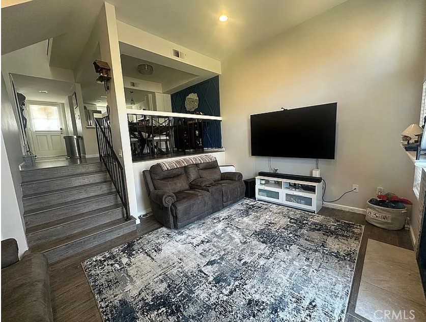 8717 Spring Canyon Drive Spring Valley, CA 91977 - Photo 32 of 34 a living room with furniture and a flat screen tv
