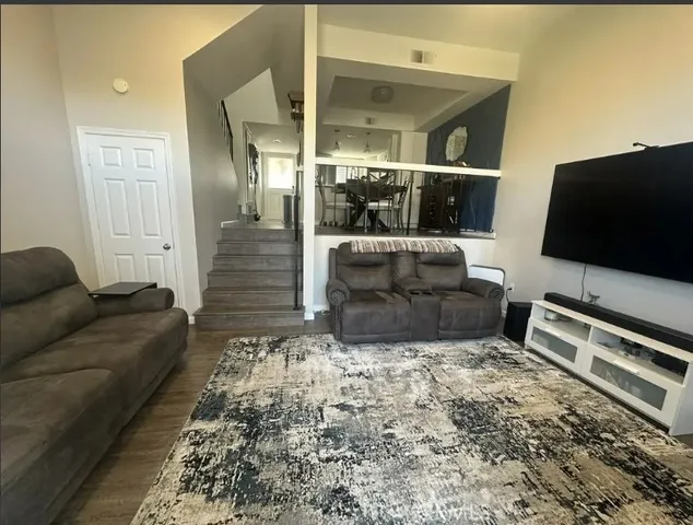 a living room with a couch and a flat screen tv