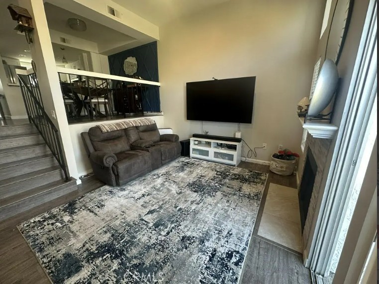 8717 Spring Canyon Drive Spring Valley, CA 91977 - Photo 10 of 34 a living room with furniture and a flat screen tv