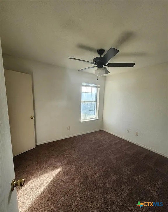1601 Dugger Circle Killeen, TX 76543 - Photo 14 of 15 an empty room with a ceiling fan and a window