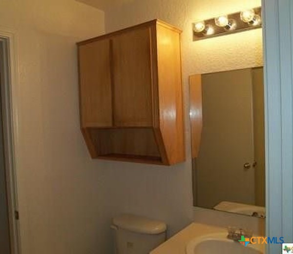 1601 Dugger Circle Killeen, TX 76543 - Photo 6 of 15 a bathroom with a toilet and a sink