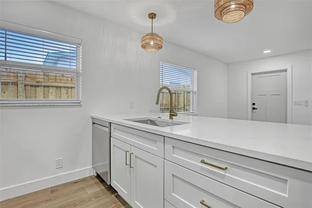 a view of kitchen with cabinets