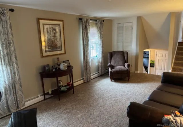 a living room with furniture and a window