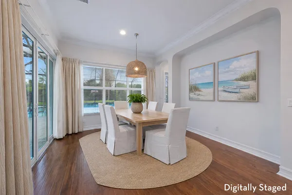 a view of a dining room with furniture window and wooden floor