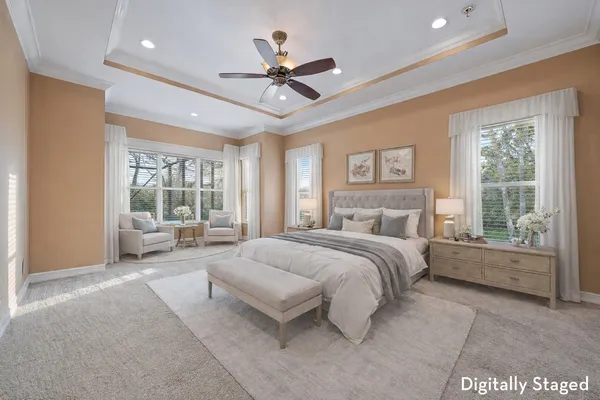 a view of an empty room with a ceiling fan and window