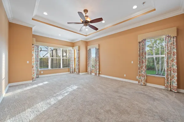 a view of a livingroom with a ceiling fan and window