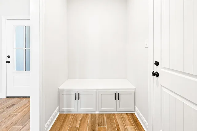 a room with a sink and a mirror