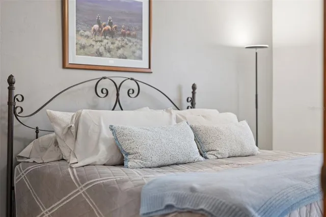 a dining room with furniture a chandelier and window