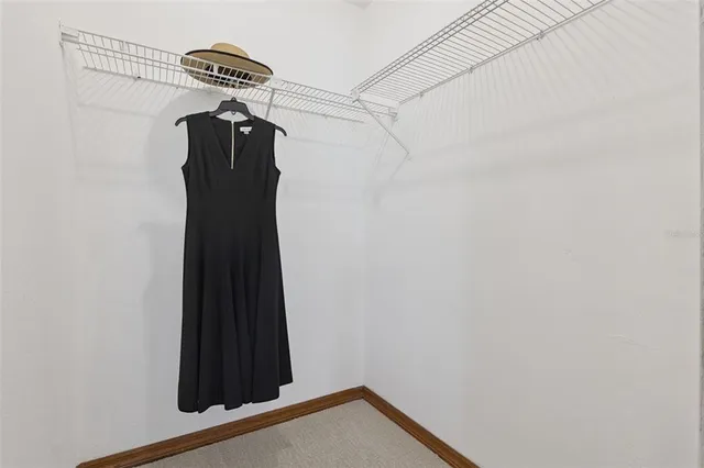 a living room with furniture a fireplace with a chandelier