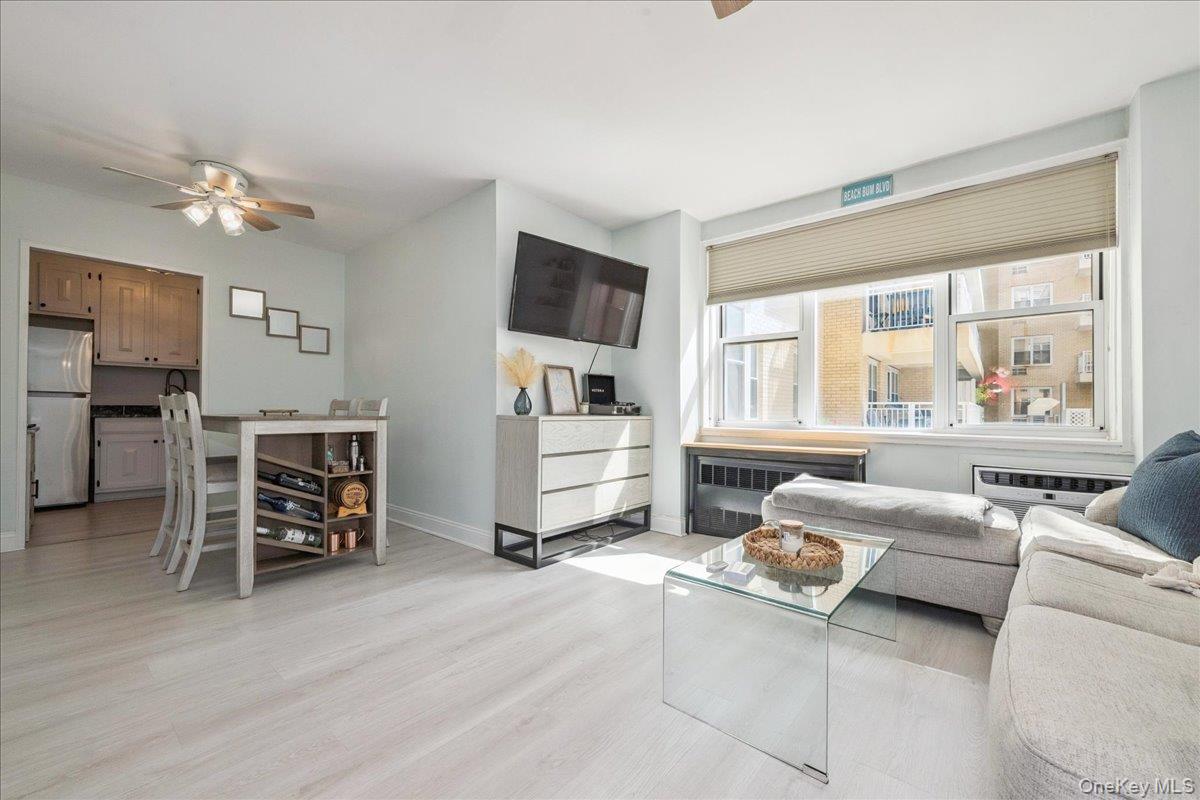 700 Shore Road, Unit 2E Long Beach, NY 11561 - Photo 12 of 31 a living room with furniture and a large window