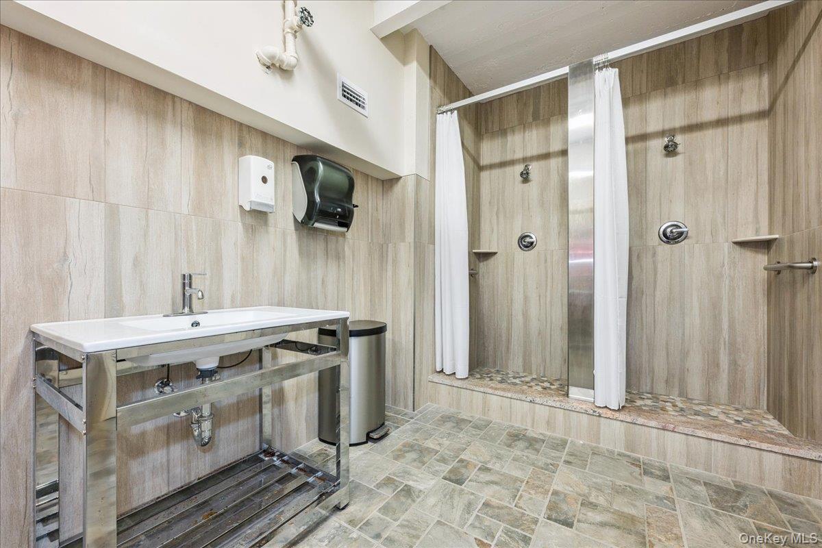 700 Shore Road, Unit 2E Long Beach, NY 11561 - Photo 28 of 31 a view of a kitchen with a sink and cabinets