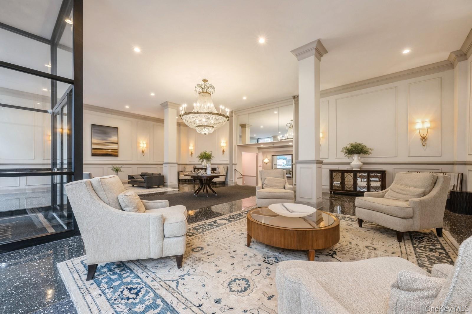 700 Shore Road, Unit 2E Long Beach, NY 11561 - Photo 5 of 31 a living room with furniture and a large window