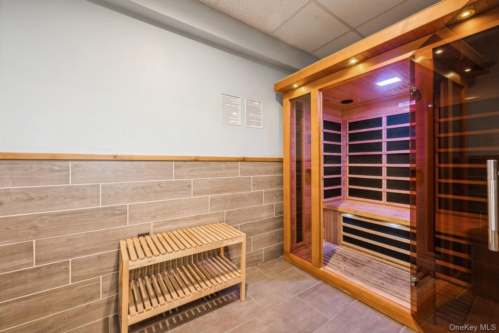 700 Shore Road, Unit 2E Long Beach, NY 11561 - Photo 8 of 31 a view of back room with wooden floor and windows