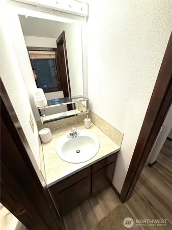 a bathroom with a sink and a mirror