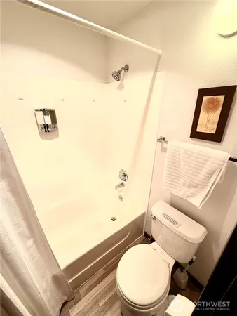 a white toilet sitting next to a bathroom sink