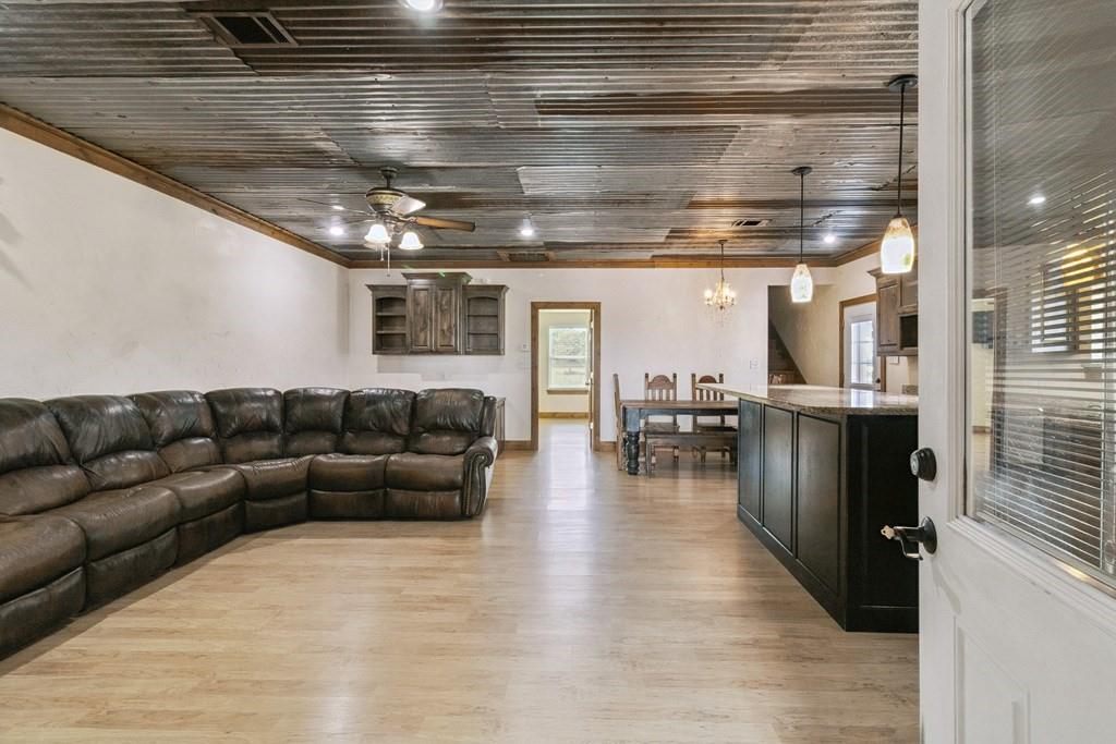 800 County Road 2807 Mabank, TX 75147 - Photo 13 of 40 a living room with furniture and kitchen view
