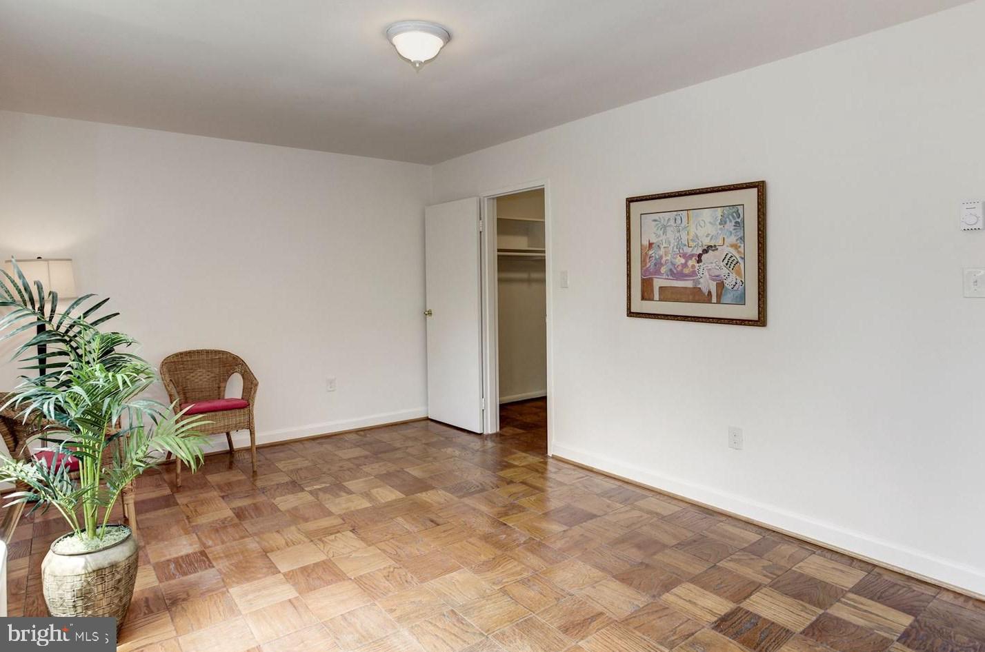 2400 41st Street Northwest, Unit 203 Washington, DC 20007 - Photo 17 of 24 a view of a hallway with a potted plant