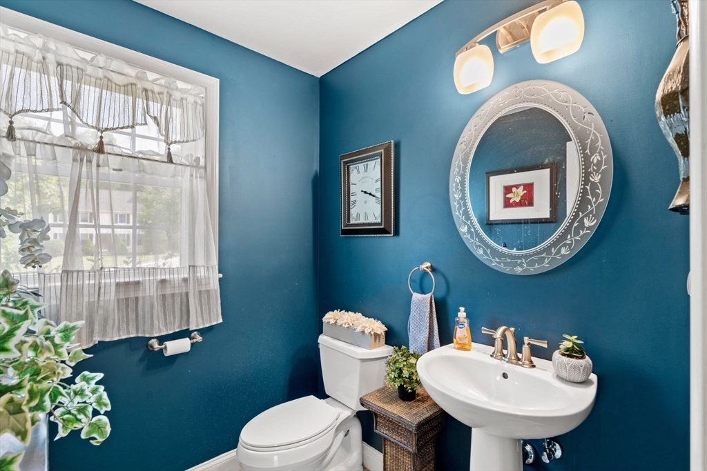 5 Comanche Circle, Unit 5 Haverhill, MA 01835 - Photo 11 of 29 a bathroom with a toilet a sink and a mirror