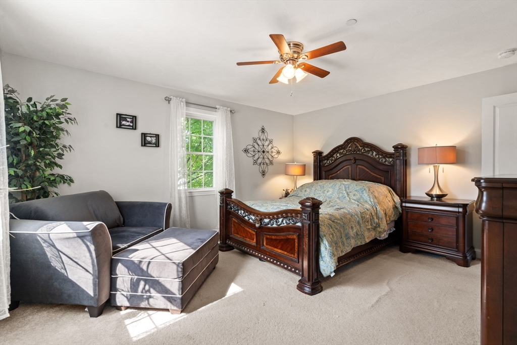 5 Comanche Circle, Unit 5 Haverhill, MA 01835 - Photo 12 of 29 a bedroom with a bed couch and window