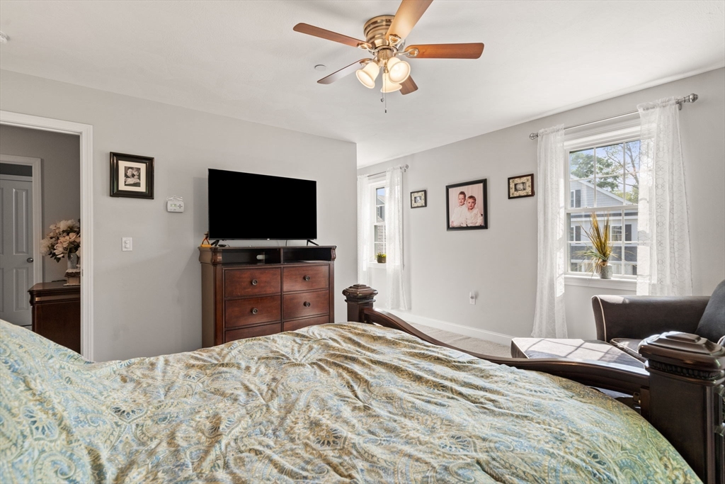 5 Comanche Circle, Unit 5 Haverhill, MA 01835 - Photo 14 of 29 a bedroom with a bed and a flat screen tv