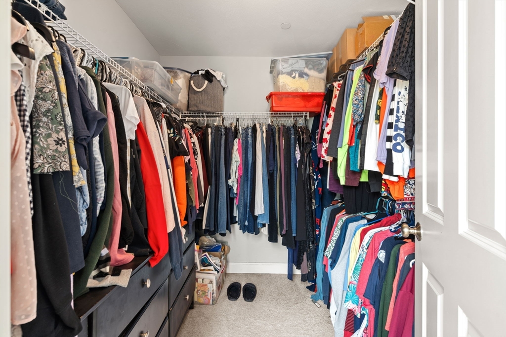 5 Comanche Circle, Unit 5 Haverhill, MA 01835 - Photo 18 of 29 a view of walk in closet with clothes