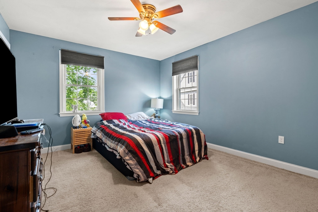 5 Comanche Circle, Unit 5 Haverhill, MA 01835 - Photo 19 of 29 a bedroom with a bed and a window