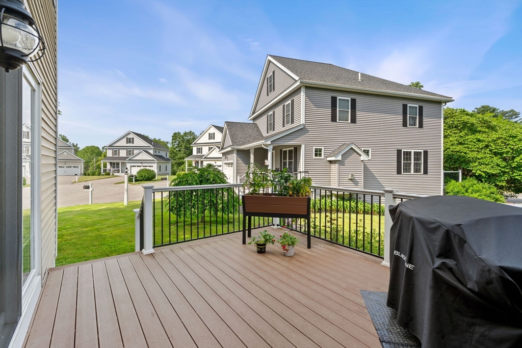 5 Comanche Circle, Unit 5 Haverhill, MA 01835 - Photo 23 of 29 a front view of a house with a yard table and chairs
