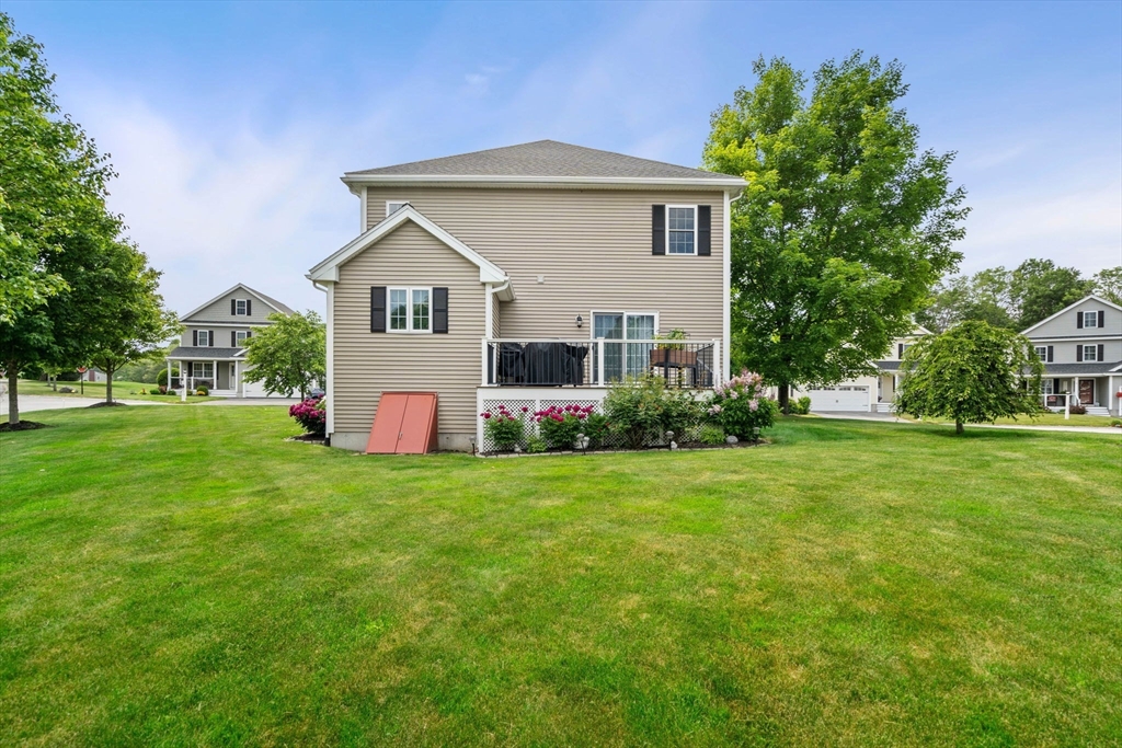 5 Comanche Circle, Unit 5 Haverhill, MA 01835 - Photo 25 of 29 a front view of a house with a yard