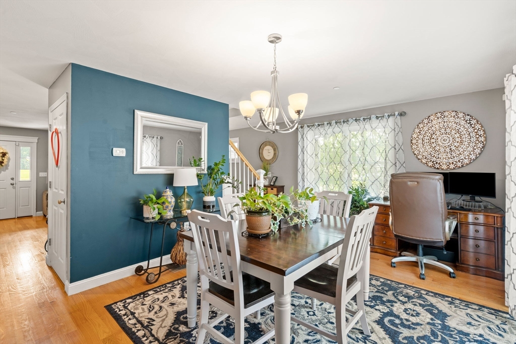 5 Comanche Circle, Unit 5 Haverhill, MA 01835 - Photo 8 of 29 a view of a dining room with furniture and chandelier