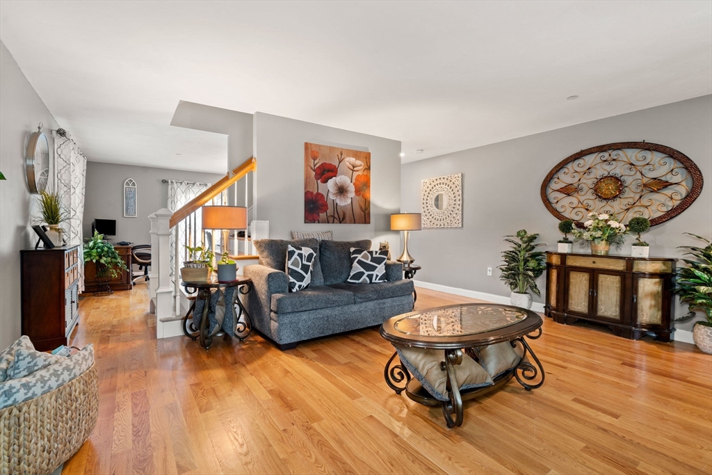 5 Comanche Circle, Unit 5 Haverhill, MA 01835 - Photo 9 of 29 a living room with furniture and a wooden floor