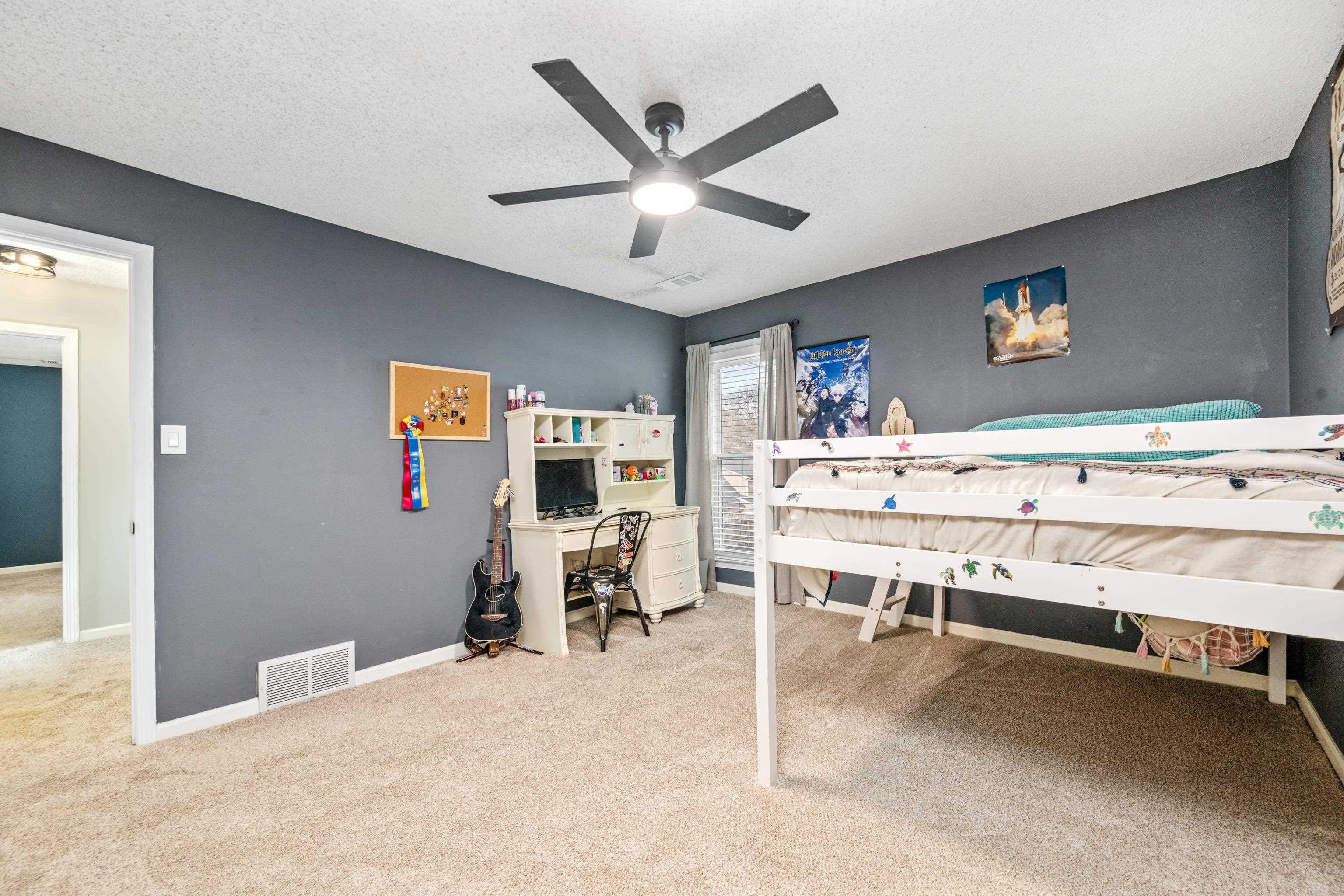 608 King Ridge Cove Collierville, TN 38017 - Photo 17 of 32 Bedroom featuring light colored carpet, ceiling fan, and smooth ceilings.