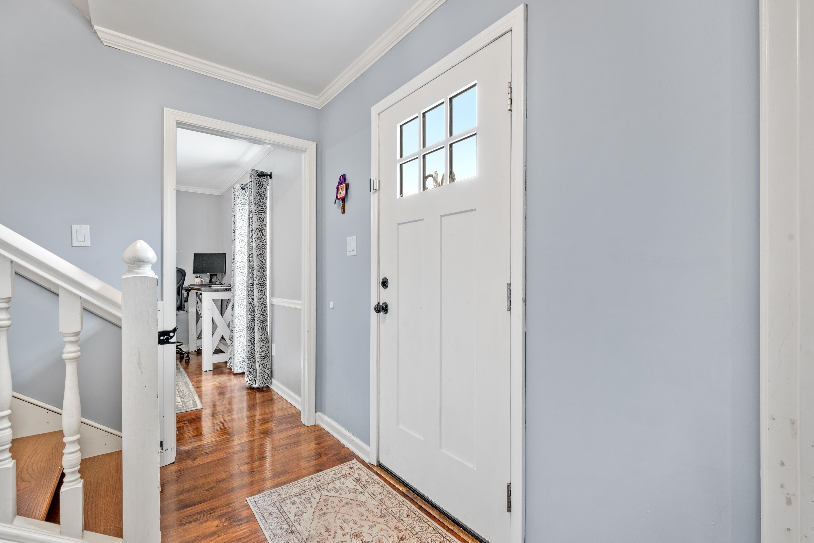 608 King Ridge Cove Collierville, TN 38017 - Photo 2 of 32 Foyer entrance featuring crown molding and wood flooring