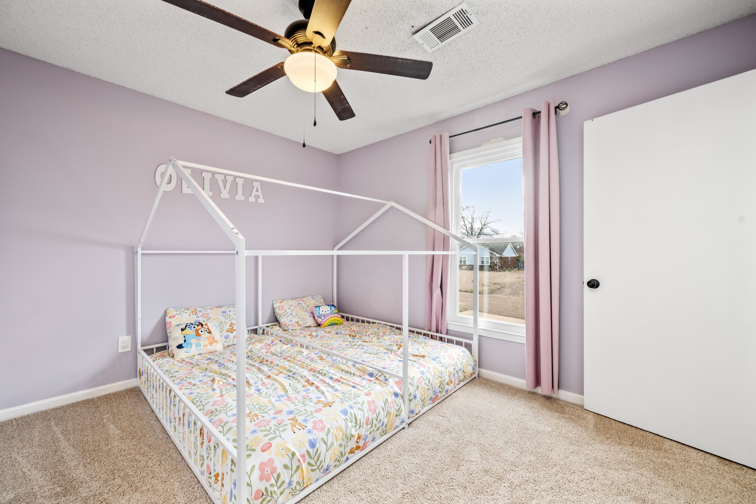 608 King Ridge Cove Collierville, TN 38017 - Photo 22 of 32 Bedroom featuring ceiling fan, light carpet, and a textured ceiling