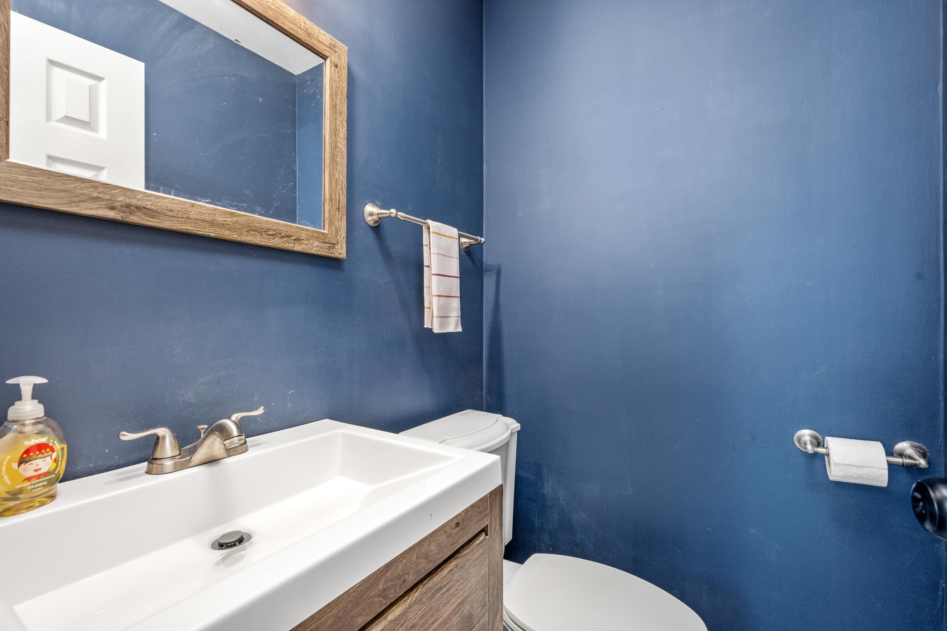 608 King Ridge Cove Collierville, TN 38017 - Photo 23 of 32 Half bath with vanity and toilet