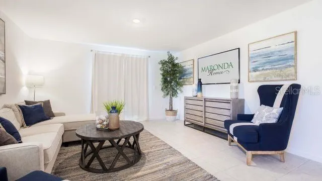 a living room with furniture or couch and a dining table