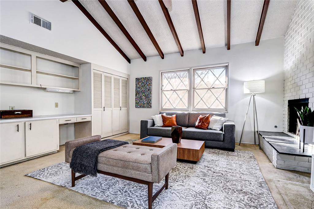 2861 Channing Way Rossmoor, CA 90720 - Photo 15 of 39 a spacious bedroom with a bed a couch and dresser