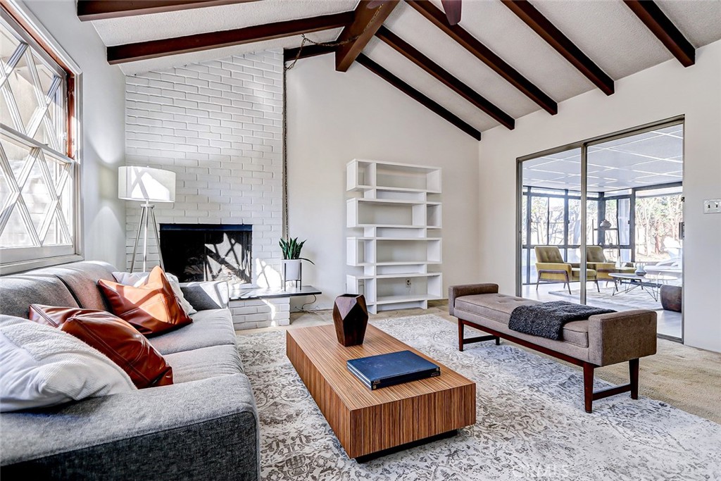 2861 Channing Way Rossmoor, CA 90720 - Photo 16 of 39 a living room with furniture rug and window