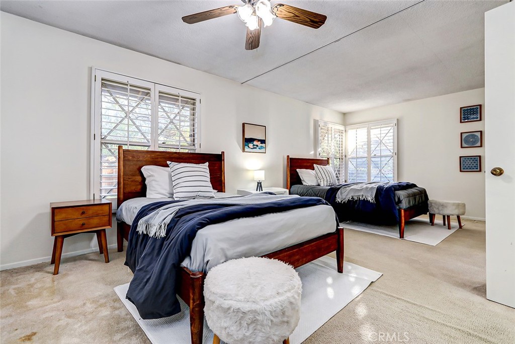 2861 Channing Way Rossmoor, CA 90720 - Photo 25 of 39 a bedroom with furniture and a large window