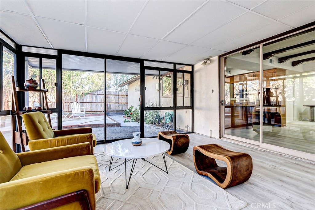 2861 Channing Way Rossmoor, CA 90720 - Photo 29 of 39 a living room with furniture and a floor to ceiling window