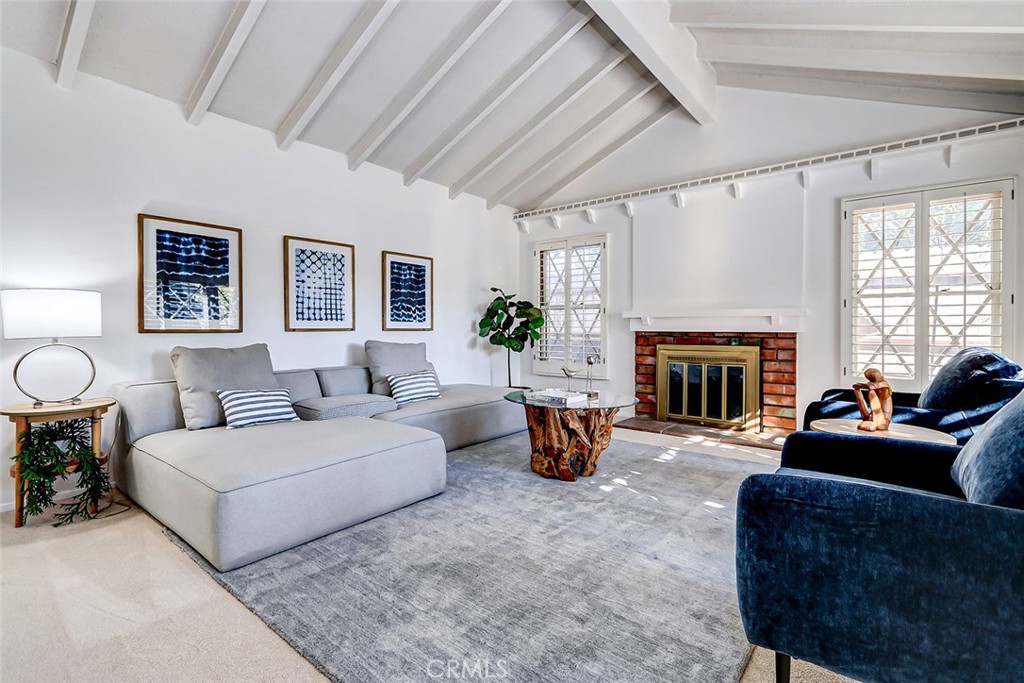 2861 Channing Way Rossmoor, CA 90720 - Photo 3 of 39 a living room with furniture a fireplace and a large window