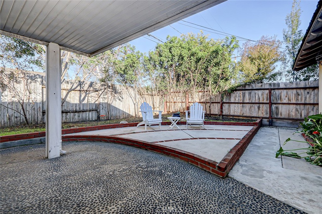 2861 Channing Way Rossmoor, CA 90720 - Photo 31 of 39 a view of a porch with furniture and a yard