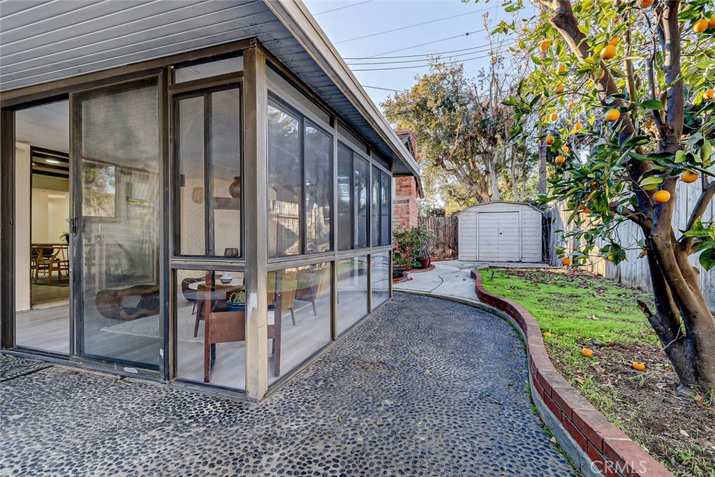 2861 Channing Way Rossmoor, CA 90720 - Photo 33 of 39 a view of a house with a yard and tree