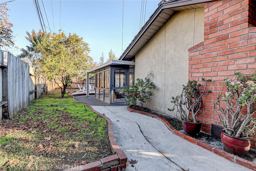 2861 Channing Way Rossmoor, CA 90720 - Photo 34 of 39 a front view of a house with garden