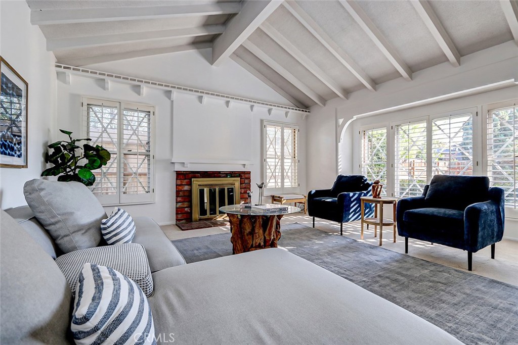 2861 Channing Way Rossmoor, CA 90720 - Photo 6 of 39 a living room with furniture fireplace and a large window